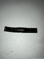 Front view showing engraving on center plate