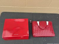 Handbag with original box side by side