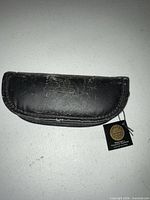 Black Franklin Mint pouch with hang tag