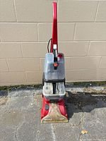 Full front view of Hoover carpet cleaner showing handle, tanks and nozzle