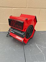 Front view showing Lasko branding, black X grill and power cord