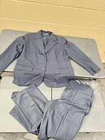 Blazer and trousers laid out showing full suit