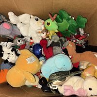 Top view of box showing mix of small plush toys