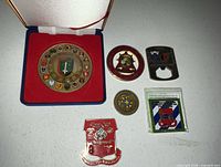 Overview showing six coins and presentation case