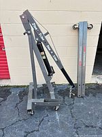 Full view of folded Pittsburgh engine hoist with casters