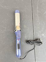 Full view of curling iron with cord