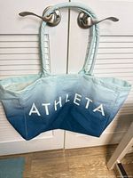 Front view showing Athleta logo and color gradient