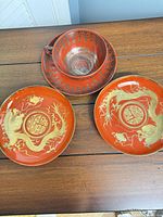 overview of teacup on saucer with two plates