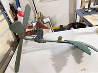 Full view showing lumberjack figure, propeller and tree panel