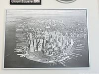 Front view of the framed black-and-white Manhattan aerial photo print