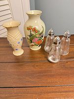 Group shot of both vases and glass shakers on table