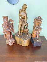 All three wood carvings together for scale and comparison