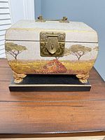 Front view of wood keepsake box with tiger artwork and brass latch