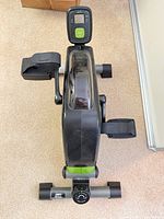 Top view of pedal exerciser showing pedals, housing, tension knob