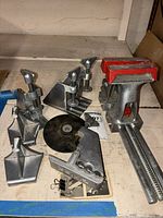 Overall view of bench vise, Zyliss clamps, wedge accessories, cut-off wheel and binder clips