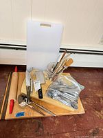 overview of lot showing boards, utensils, rolling pin, flatware bag