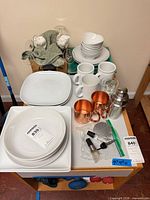overview of all dinnerware, mugs, barware on cart