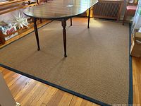 Full view of rug under dining table showing overall color and border