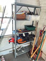 Front view of full metal shelving unit with five shelves