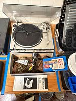 Top view of Technics SL-D30 turntable with dust cover and accessory box