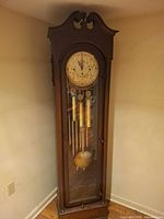 Full view of grandfather clock in corner