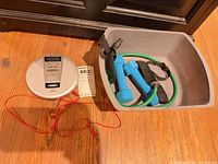 CD player, weights, resistance band in bin overview