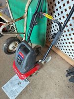 Full view of Troy-Bilt electric cultivator with handle and motor housing