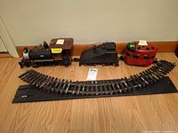 Overall lot showing both locomotives, tender, curved track and straight track