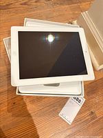 Front of white iPad in box lid