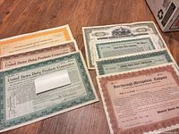 All seven certificates laid out on table