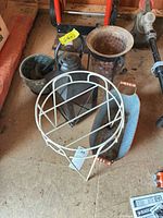 Group shot showing plant stand, lantern, perforated planter, oval planter and pail