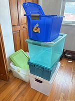 Stacked view of all seven bins in varying colors and sizes