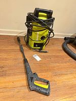 Front view of Sun Joe SPX1000 washer with spray wand