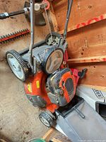 Full view of Husqvarna HU725FH mower in shed