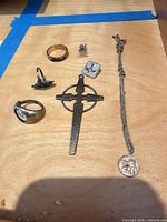 Overview of all seven jewelry pieces on table