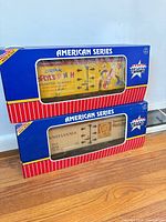 Two boxed USA Trains American Series model boxcars