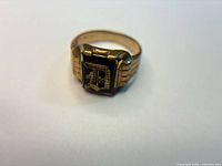 Front view of ring showing black inlay and letter D
