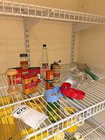 All items arranged on shelf showing overall lot