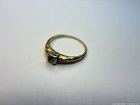 Full view of ring showing band and missing stone setting