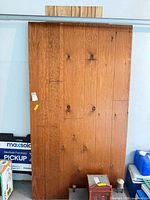 Full view of largest wood paneling sheet with visible grain and grooves