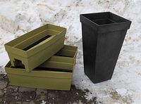 Group shot of two green railing planter boxes stacked beside tall dark grey planter