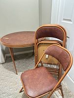 table and stacked chairs showing overall style and color