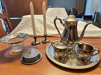 Full lot showing tray, coffee service, candlesticks, candy dish, coaster stack