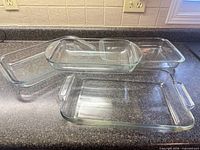 All four rectangular glass baking dishes displayed on countertop