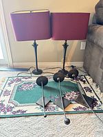 Full lot: two lamps with shades, rug, three sconces