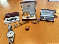 Overview of all cufflinks, tie clips, tie pins, watch, ring, Victorinox tool and boxes
