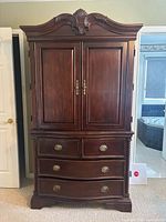 front view closed showing full armoire dresser