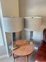 Both matching table lamps on side table