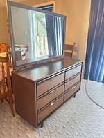 Front view of six-drawer dresser with attached mirror