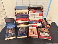 Full lot showing two tall stacks and six front-facing Reagan and Cold War books